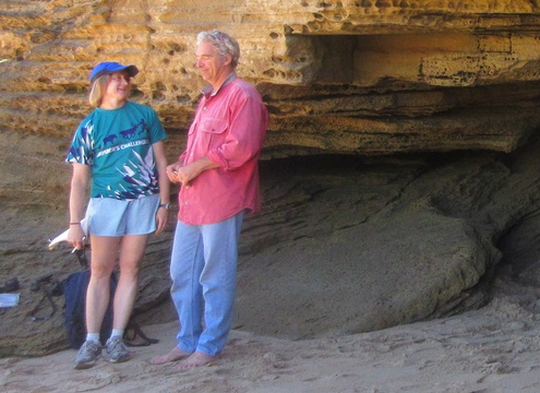 Linda Helm and Guy Thesen at the mouth of the cave in which they and Charles Helm discovered 90,000 year-old fossil hominin footprints near Knysna, South Africa. Image made by Charles W. Helm on the day the footprints were discovered 